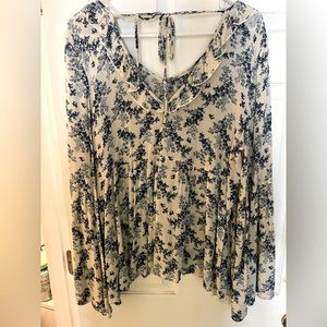 Large flowy boutique top with bell sleeve.